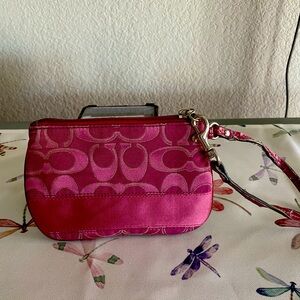 Coach fuchsia wristlet used